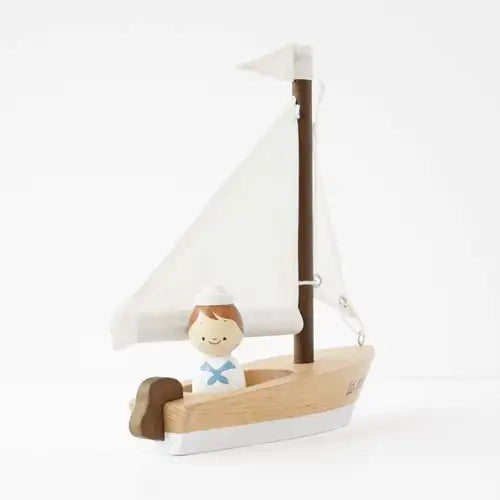 voilier en bois et capitaine